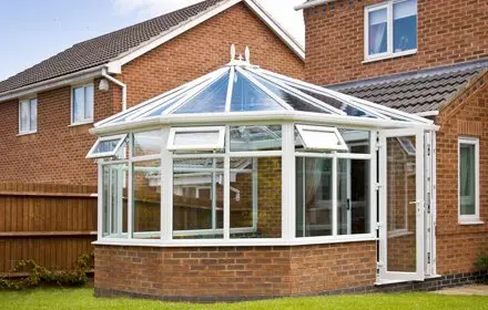 conservatory with white panels and double doors